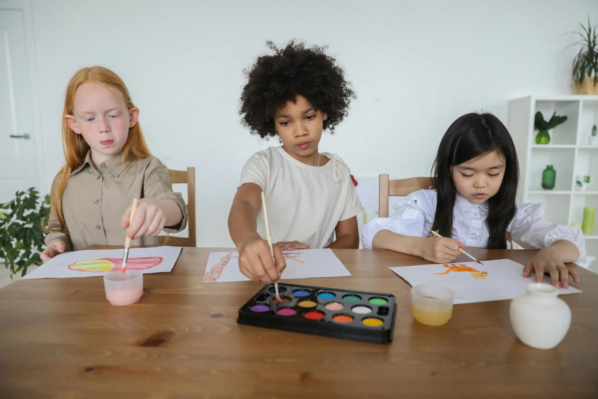 Three children painting