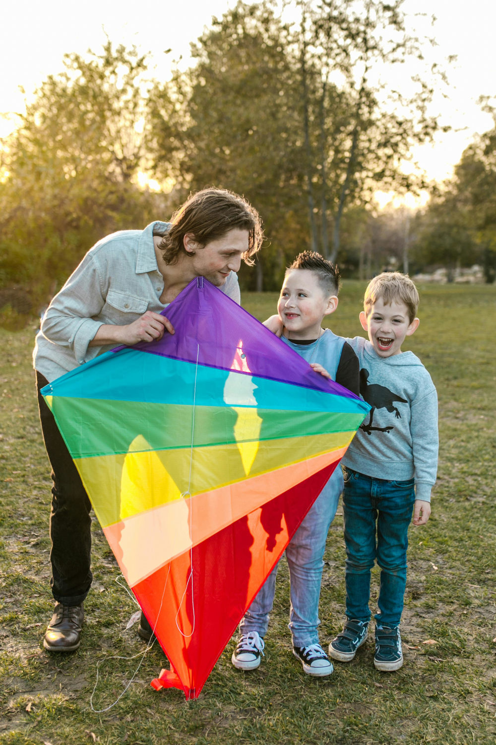 Parent and kids with a kite